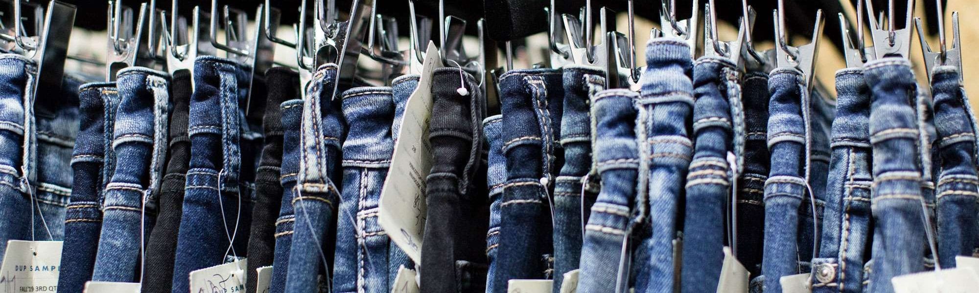a rack of jeans