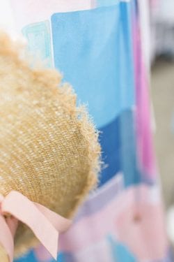 close up of a fringed straw hat