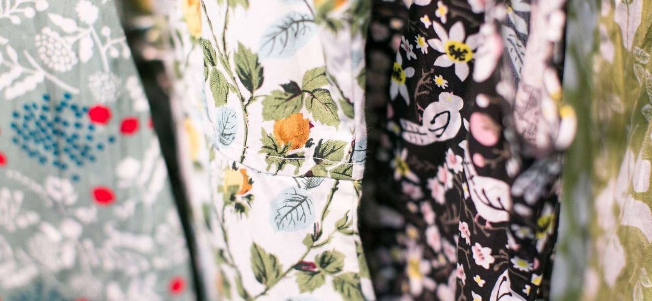 a close-up of four different flower patterned fabrics